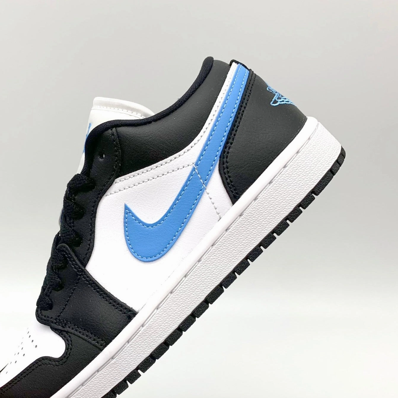 Jordan 1 Low Black University Blue White Sneaker Rivalry